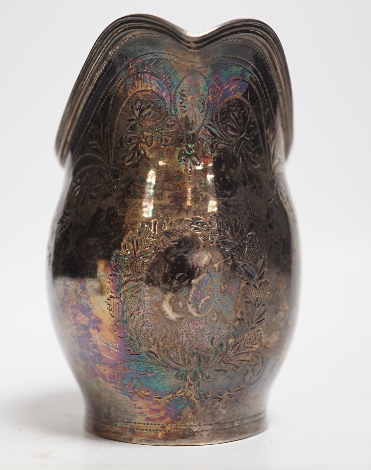 A George III engraved silver helmet shaped cream jug, London, 1799, 10.4cm, 3.2oz.